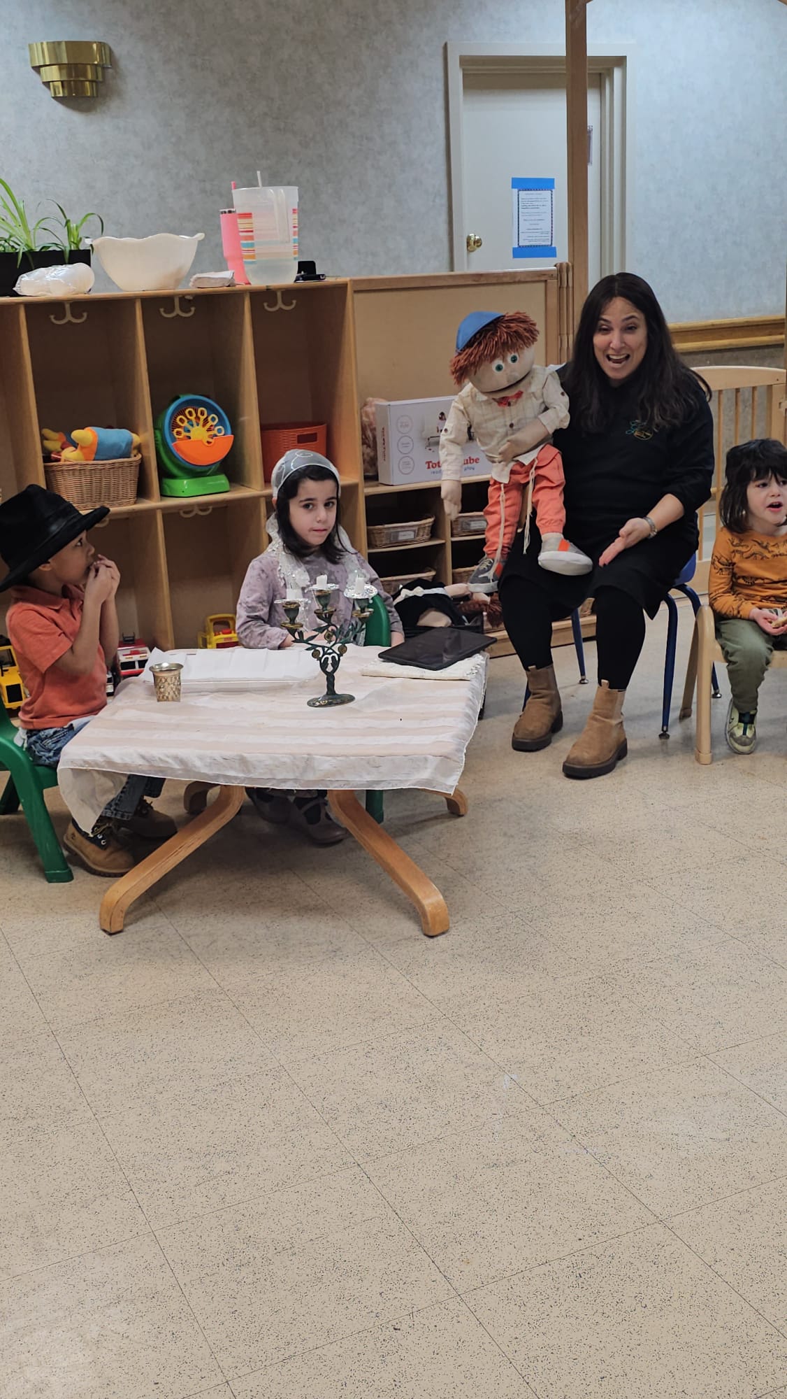 Doba Weber teaching with a puppet in her preschool classroom